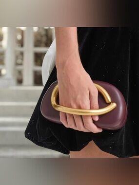 Women's Burgundy/Brown Leather Clutch with Gold Sculptural Handle. BRAND NEW.